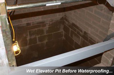 Wet elevator pit before waterproofing, showing water intrusion issues in the brick walls and floor, requiring elevator pit waterproofing.