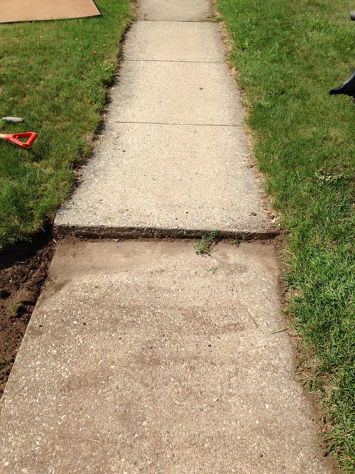 Before and after concrete walkway repair, showing the replacement of a damaged gravel path with a smooth, ADA-compliant sidewalk.